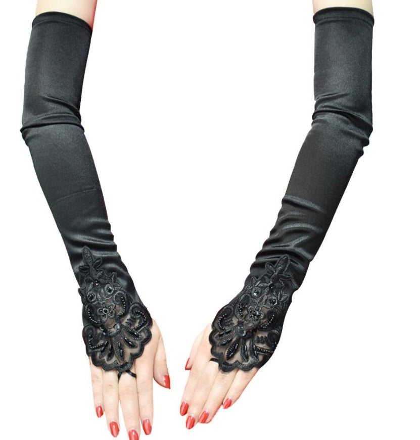 Women's elegant fishnet lace long fingerless gloves, gothic and vintage style accessory.
