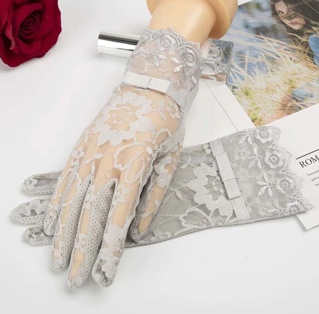 Women's elegant fishnet lace long fingerless gloves, gothic and vintage style accessory.