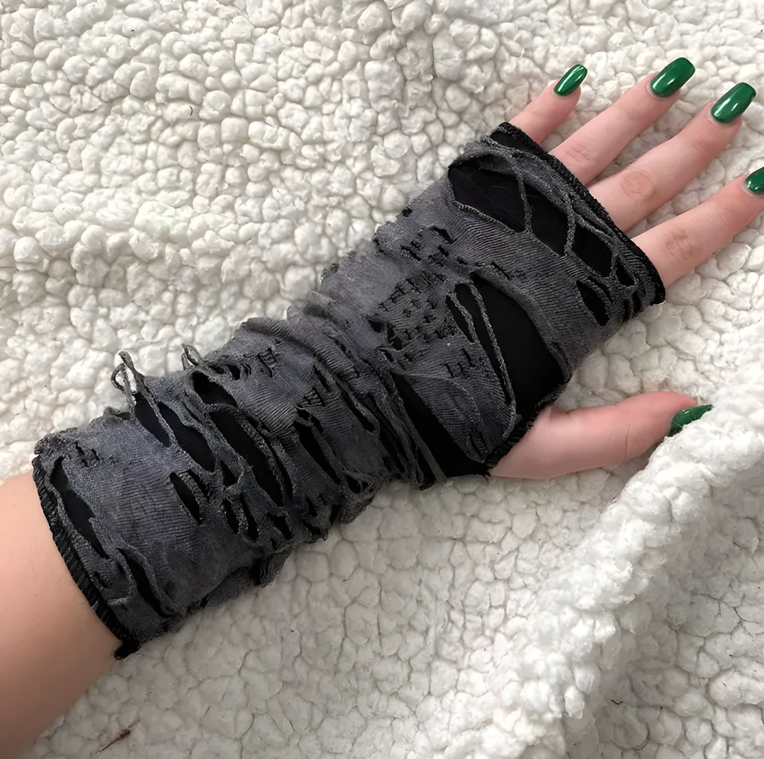 Women's elegant fishnet lace long fingerless gloves, gothic and vintage style accessory.